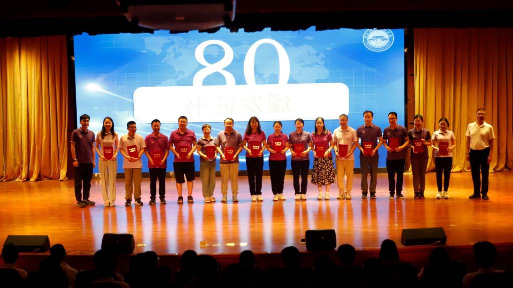 A group of people standing on a stage with a medium credibility description is automatically generated